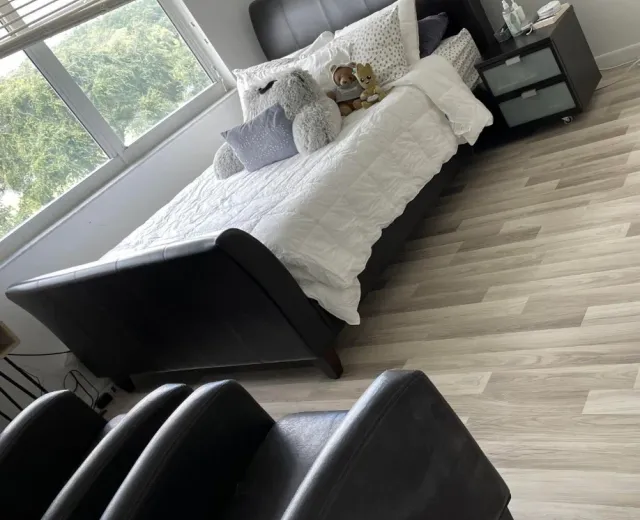 Freshly made bedroom in a Little Havana-style bungalow after an Ire Cleaning Services clean